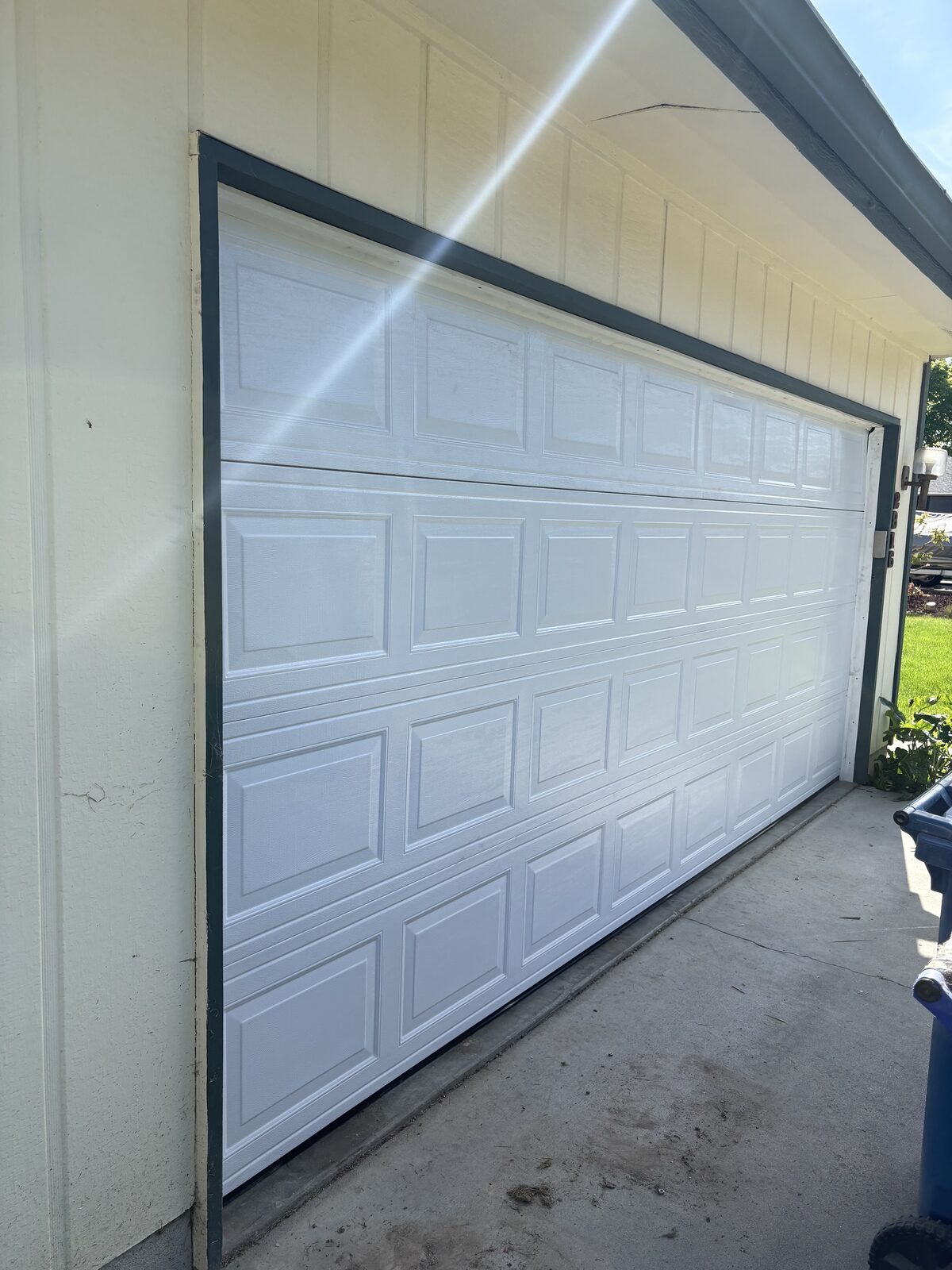 New white double garage door installed by UP & FIX