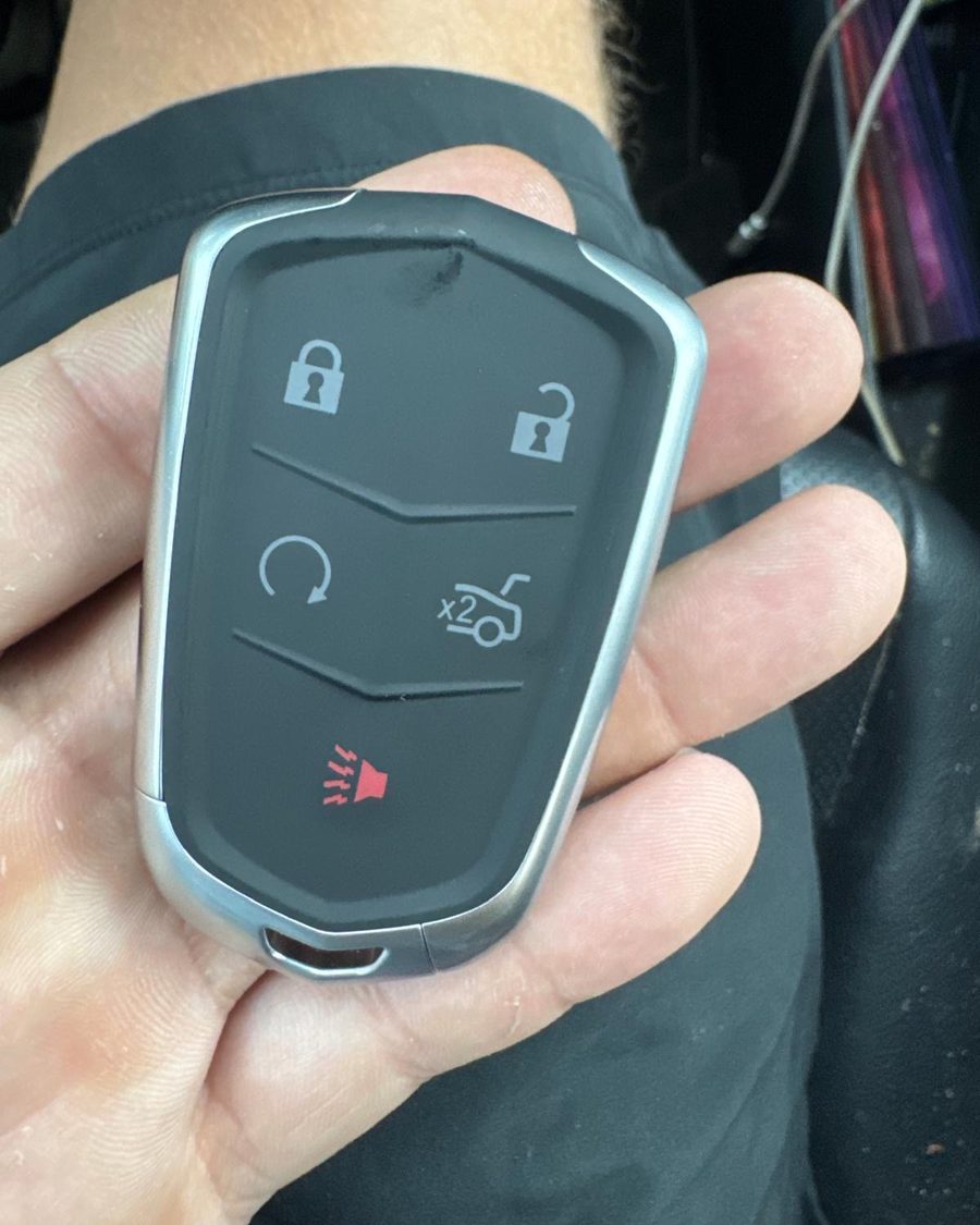 Replacement Cadillac smart key fob held in hand after programming