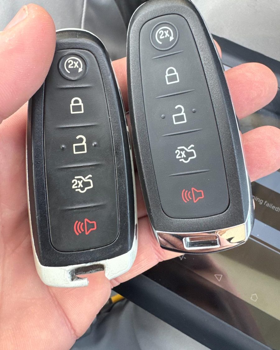 Two Ford remote key fobs, an original and its replacement