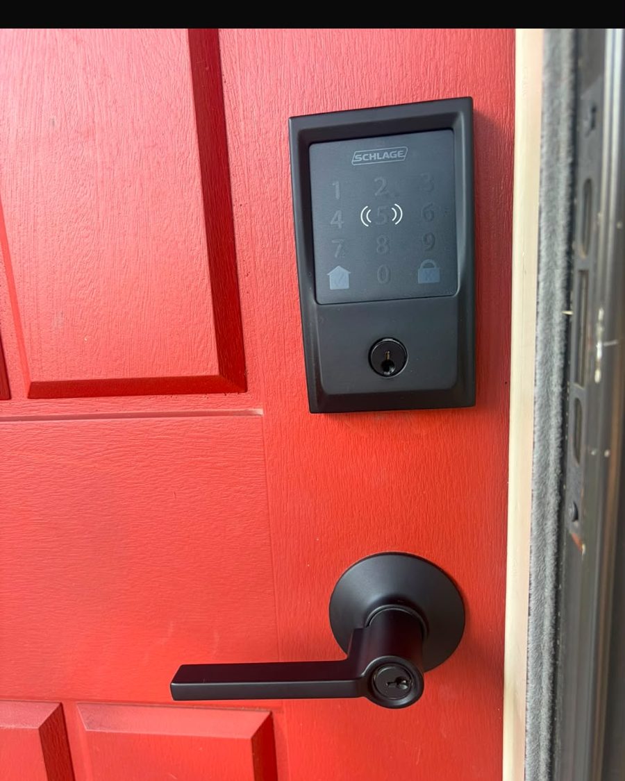 Keypad smart lock and lever fitted to a red front door